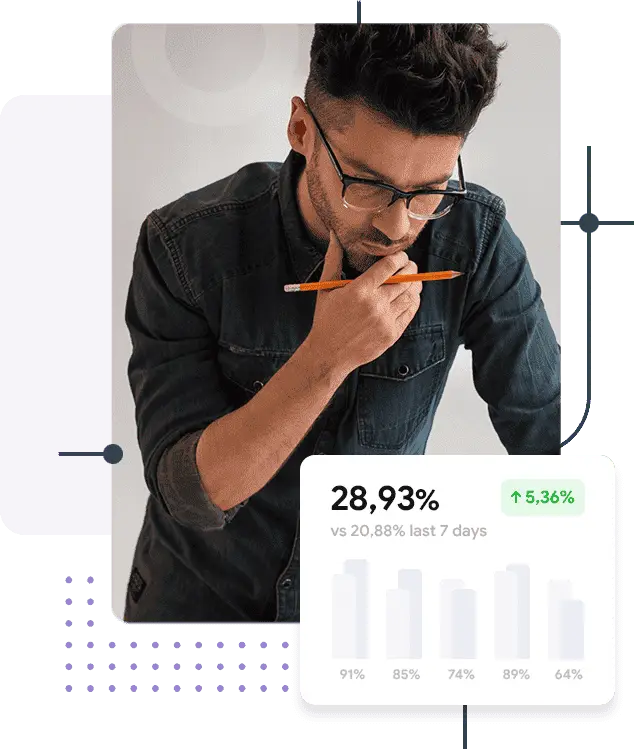 Man analyzing data with a pencil in hand, showing a performance graph with a positive growth trend